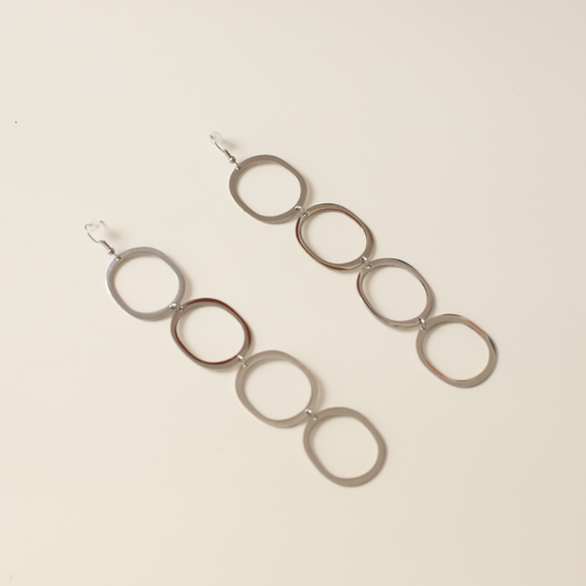 Pendientes circulares silueta plata