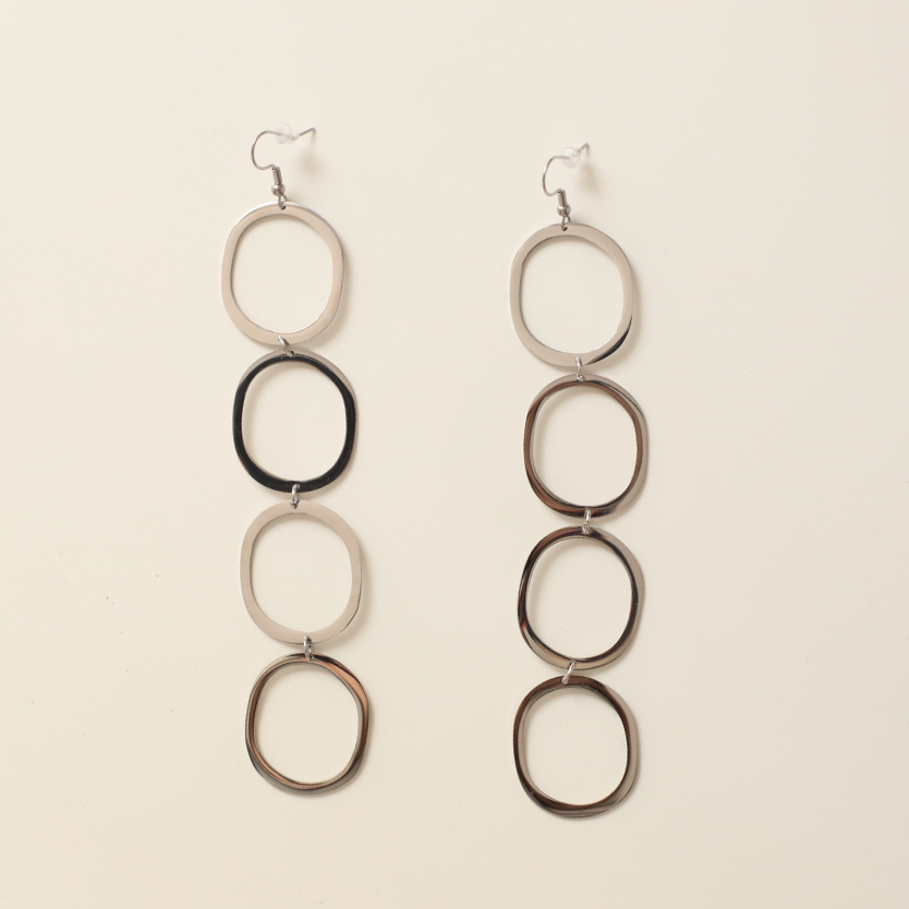 Pendientes circulares silueta plata